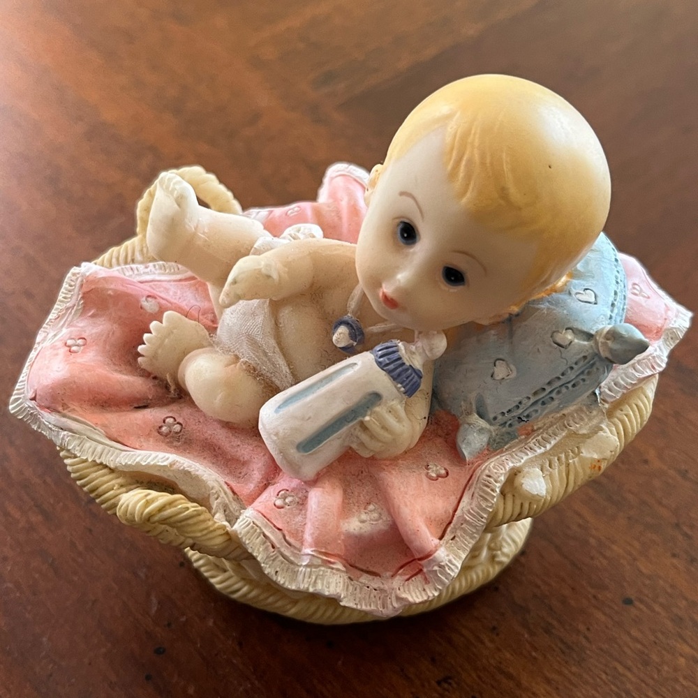 Adorable Baby Figurine with Pink Blanket